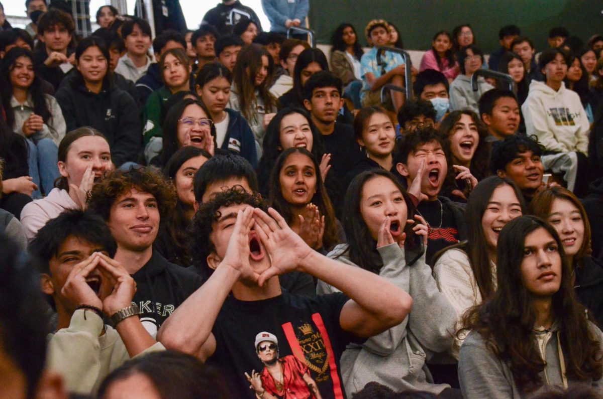 Students cheer during the knockout basketball tournament in the spirit assembly on Monday. Max Xing (12) won the competition, gaining points for the Class of 2024.
