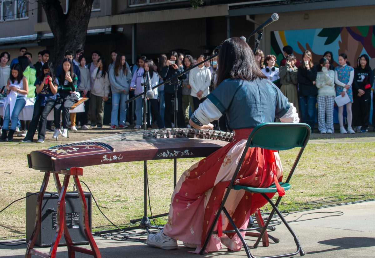 Grace Fu (9) plays “Spring Is Back to Lhasa” on the guzheng before a large audience. Dozens of students performed in nine acts. 