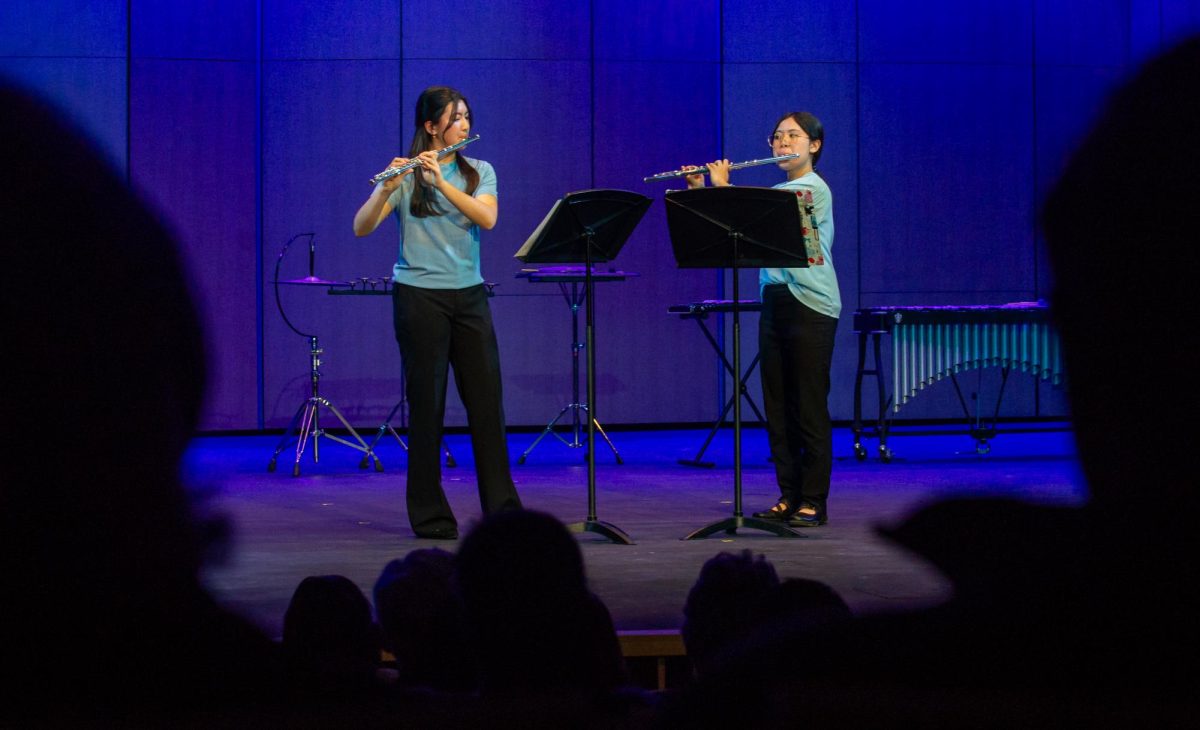 Ellie Schmidt (12) and Jessica Wang (11) play “Andante Et Rondo” by Franz Doppler on the flute. Both performers hold the co-principal position for the Harker Orchestra flute section.