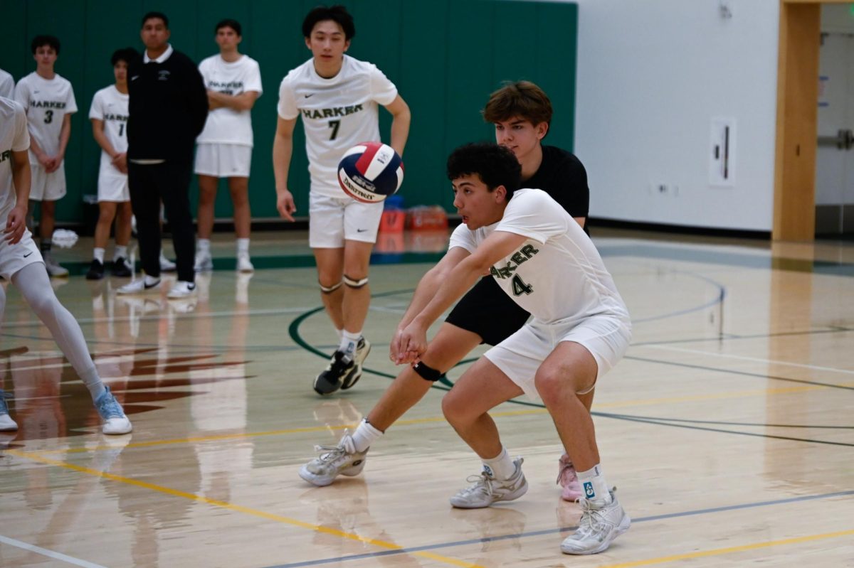 Co-captain and outside hitter Zachary Blue (12) receives a serve. Strong passing allowed the Eagles to run a more diverse offense and create more scoring opportunities on Wednesday.  