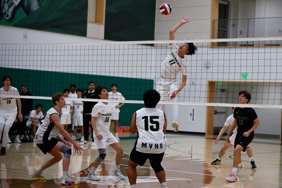 Middle Kairui Sun (10) swings off of a quick set. The Eagles aim to emphasize setter-hitter connections as part of their offensive strategy for the season. 