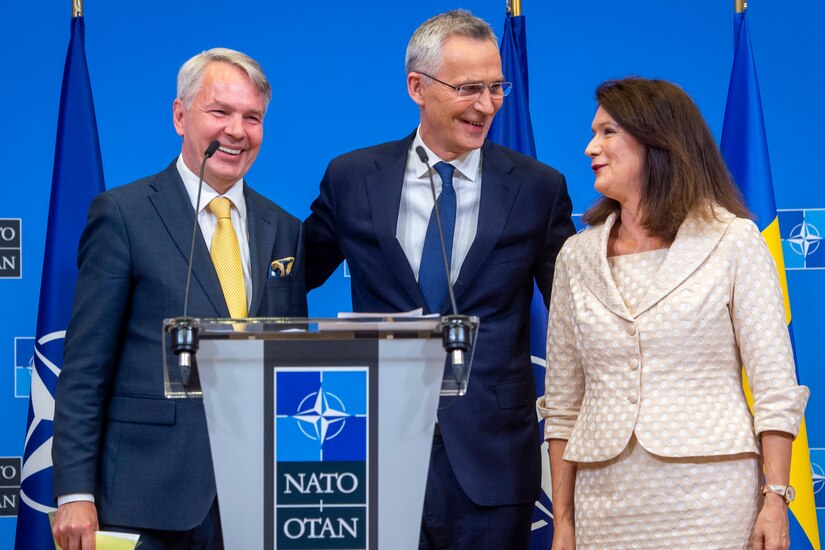 Finlands Foreign Affairs Minister Pekka Haavisto, NATO Secretary General Jens Stoltenberg and Swedens Foreign Affairs Minister Ann Linde speak during a press conference following the two countries signing of accession protocols to NATO. While NATO admitted Finland in nine months, Sweden was beset by obstacles that delayed its accession by another year.