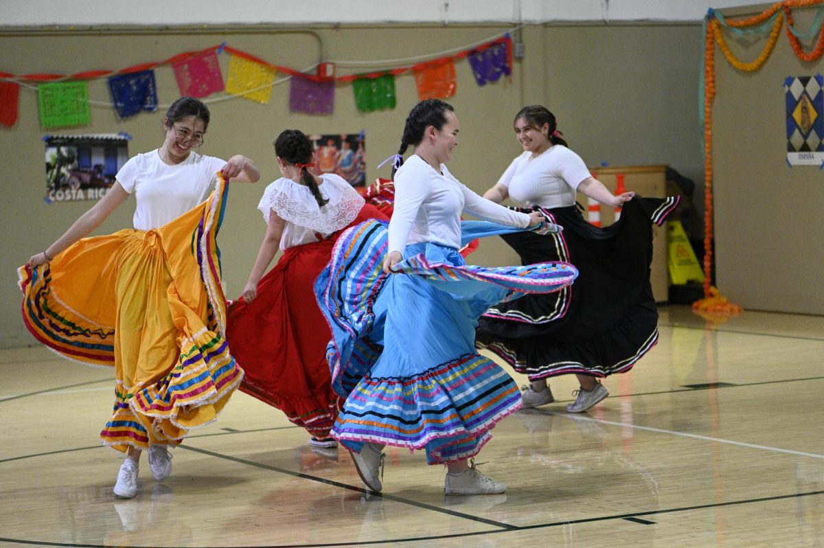 Mariana Ryder (12), Sofia Vasquez-Perez (10), Natalie Warmdahl (9) and Brianna Madrigal (9) dance to La Negra, a Mexican folk song. “Watching everybody do their acts is really awesome because you see people you dont really see every day, and you see what theyre capable of doing and their talents,” Bhavya said. 