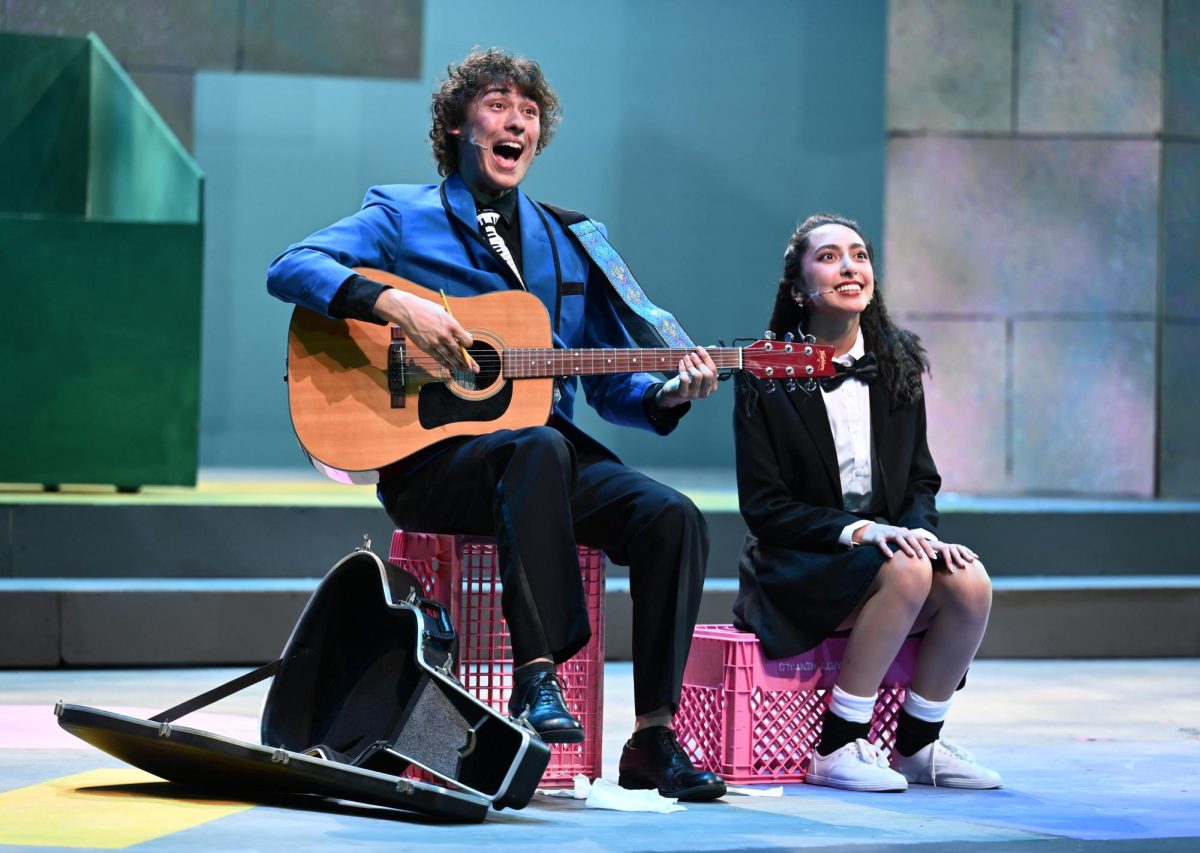 Ian Ogden (12)’s Robbie Hart and Shareen Chahal (12)’s Julia Sullivan sit on stage as Robbie attempts at writing a new wedding song for his bride-to-be Linda. Those final moments interacting with my friends’ solidified characters, those moments are what make theater, Ian said. 