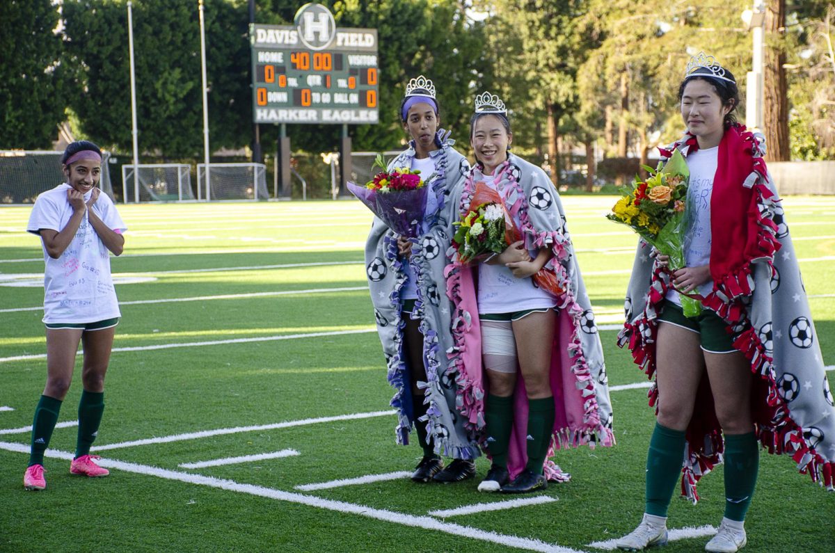 Senior Cynthia Wang receive gifted tiaras and flowers from their teammates during the varsity girls soccer senior night on Feb. 8. The girls faced and won against Priory 3-1.
