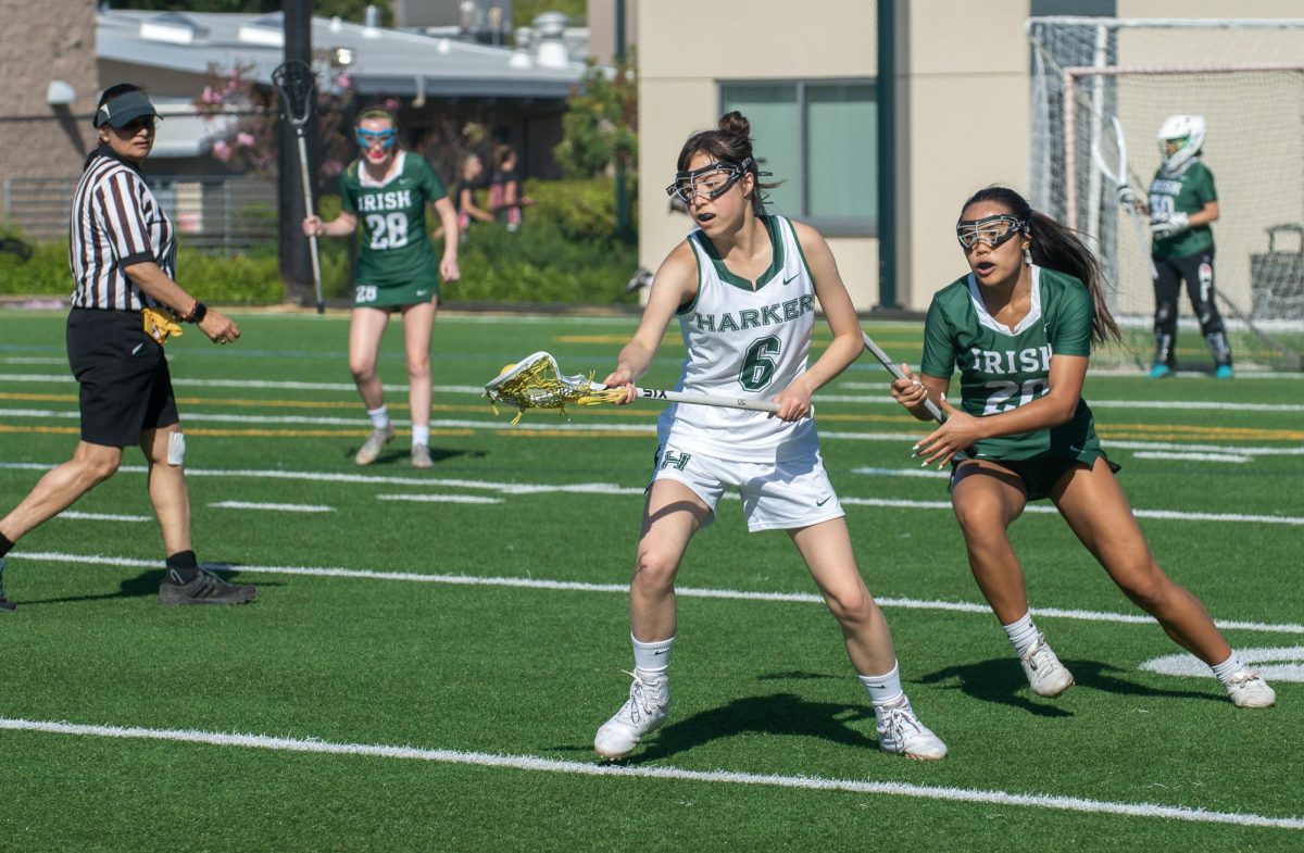 Defender Genieve Malinen (11) takes possession of the ball. Although the Eagles struggled to solidify a lead, they were able to score three goals, with captain Chayce Milheim (11) scoring in the last minute of the game. 