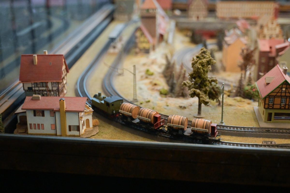 A train carrying barrels chugs along a set at the Model Train Gallery in Union Station. The gallery recently completed a major renovation in November. 