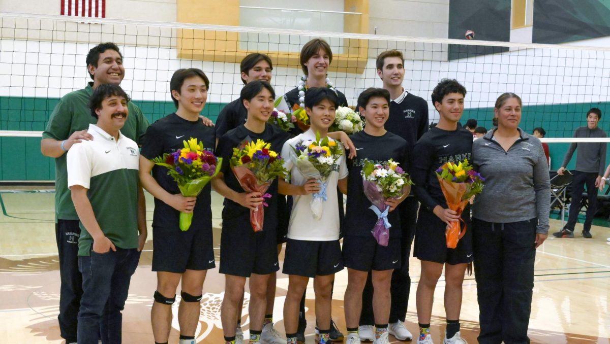 Varsity boys volleyball seniors pose with their coaches for a photo during the senior night ceremony. The team concluded their regular season with a 25-9 record and the first-place spot in the Santa Clara Valley Athletic League De Anza division. 