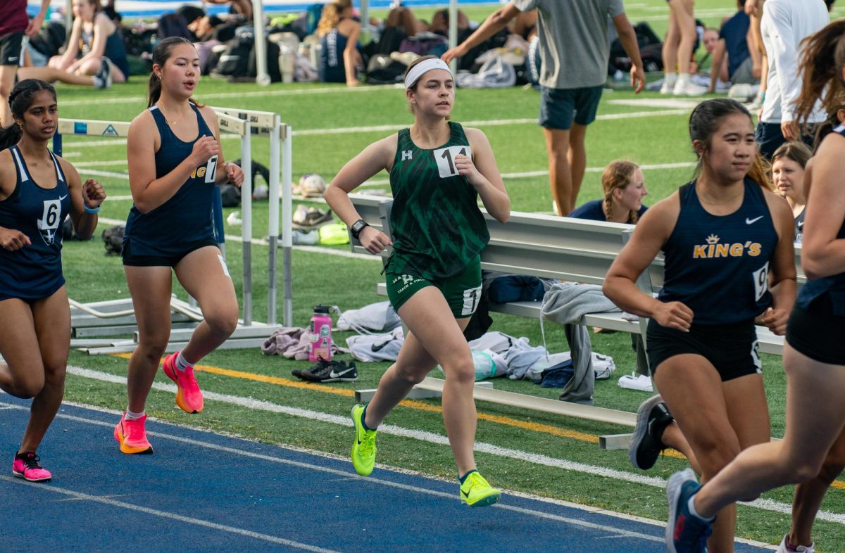 Sophie-Grace Degoricija (11) soars through the air during the long jump event. She set a personal record at the Bellarmine meet with a distance of 13’1.