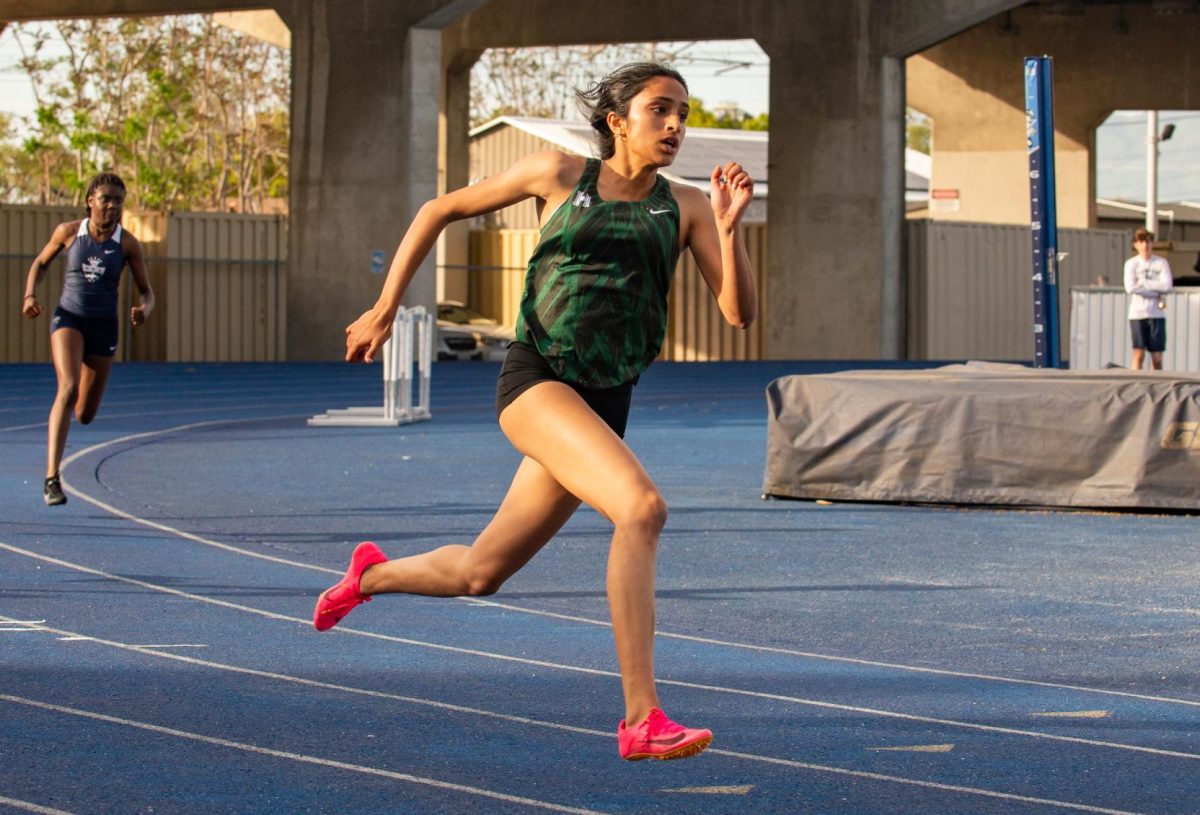 Senior Anjali Yella strides powerfully down the track during the women’s 100-meter race. She took first place in all three events she competed in and aims to build on her winning streak. “Our league meets are coming up so I hope to do well again and then carry that momentum in the CCS and hopefully states,” Anjali said.