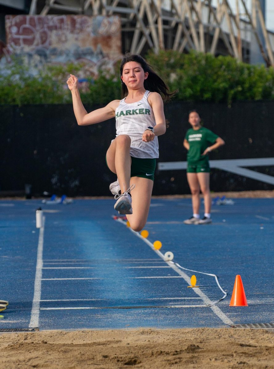 Sophie-Grace Degoricija (11) soars through the air during the long jump event. She set a personal record at the Bellarmine meet with a distance of 13’1.