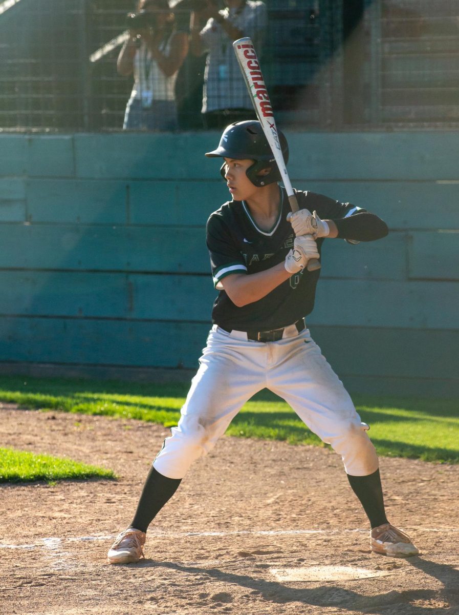 Senior Brandon Zau prepares to swing at the baseball. Brandon scored the first run of the game against Jefferson High School. 