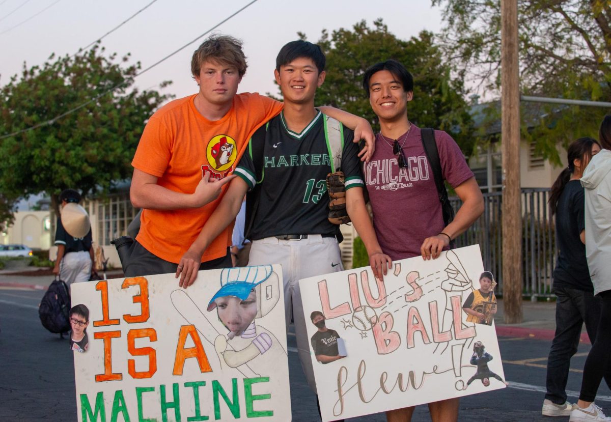 Seniors Lachlan Rossi, Nathan Liu and Daniel Lin pose for a photo with handmade posters celebrating Nathan. “Our senior night game was the perfect send-off for us seniors since everyone had their moment to shine and demonstrated why this team feels so special to me,” Nathan said. 