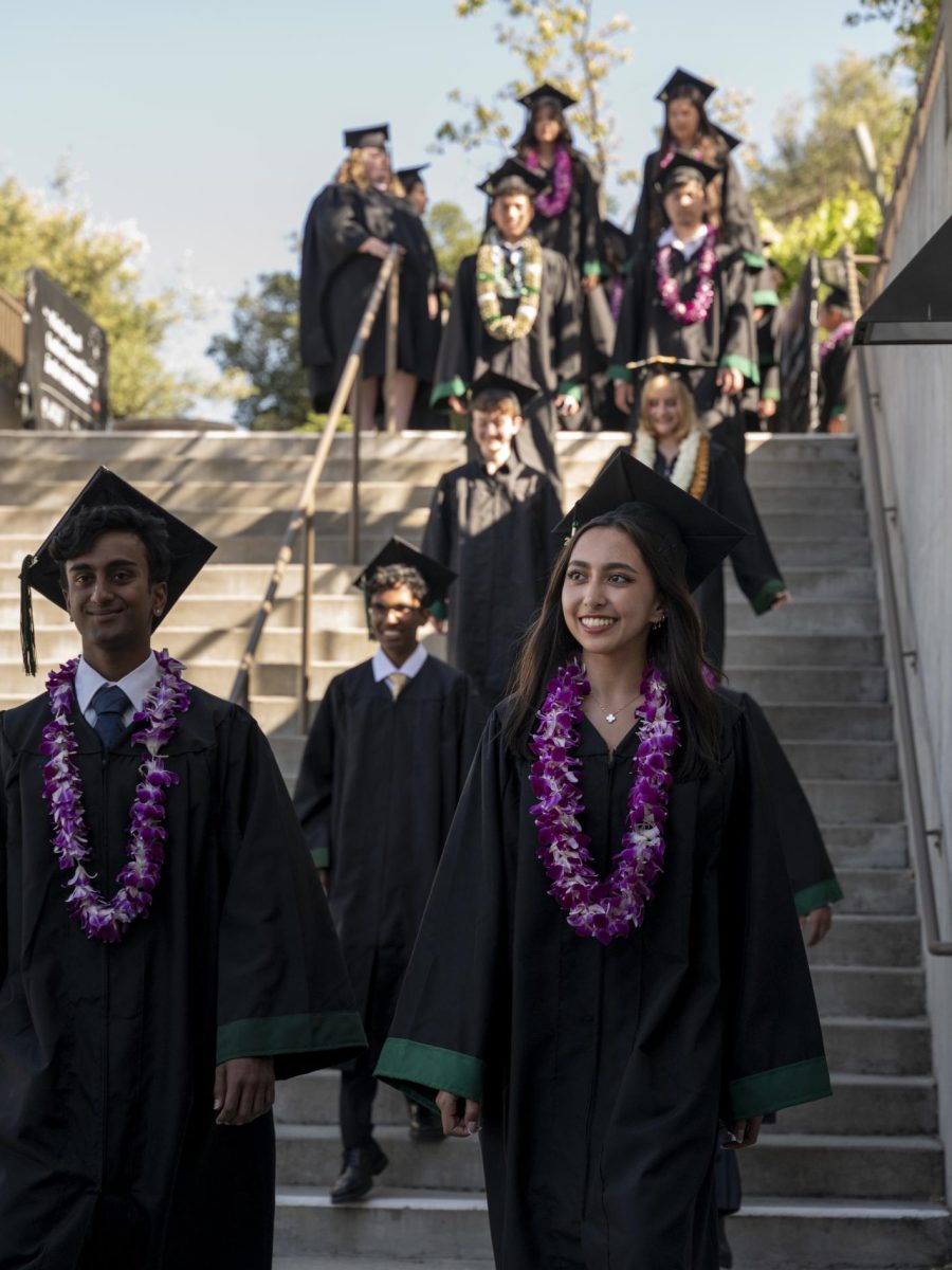 Shareen Chahal (12) descends the staircase into the Mountain Winery amphitheater. Seniors walked out in pairs and took their seats, alphabetically ordered by last name.