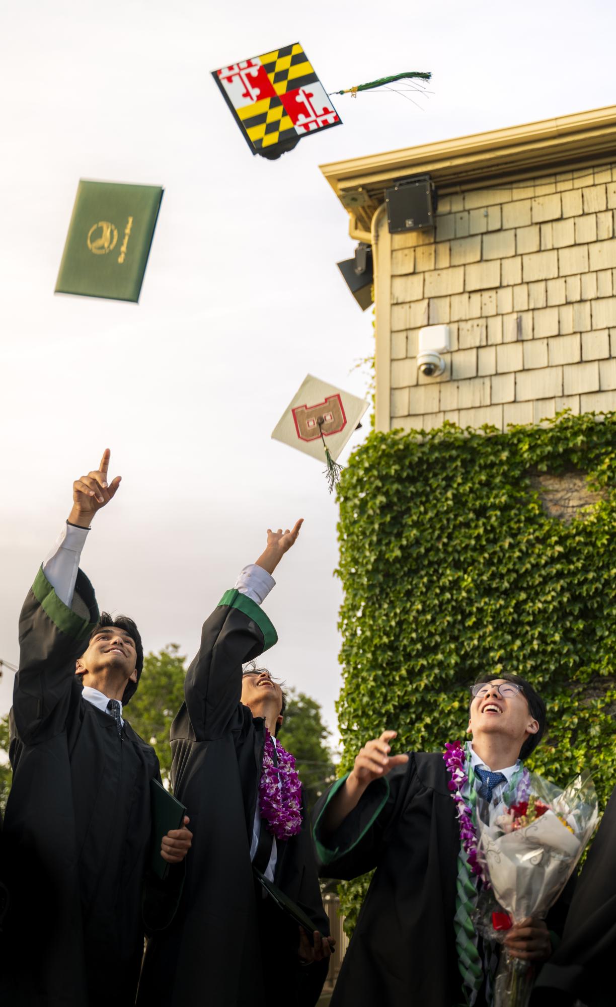 Seniors Reza Jalil, Max Xing and Adrian Liu toss their caps. “You are both the tree and your own orchard, and part of a larger orchard,” Yager said. “The beauty of a tree and an orchard is that they get to start over each year.