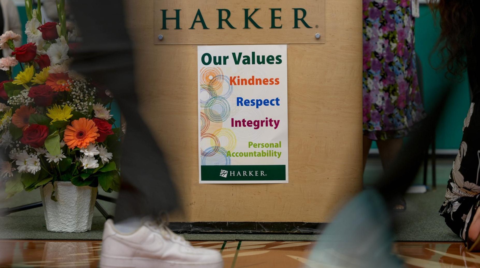 Frosh walk past the podium to sign the Matriculation book. Speeches centered around on the four Harker values. 