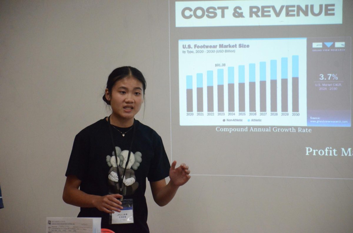 Attendee Jillian Chen (9) presents market analysis during the Innovation Challenge. Other DECA Launch activities included scavenger hunts, riddles and Kahoots. 