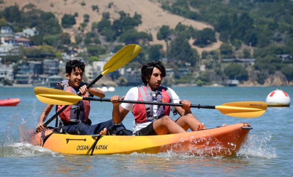 Juniors Veeraz Thakkar and Mikhil Kiran paddle in a kayak during the Class of 2026's trip to Angel Island. Students had the option to participate in various activities including hiking, kayaking and playing on the beach.