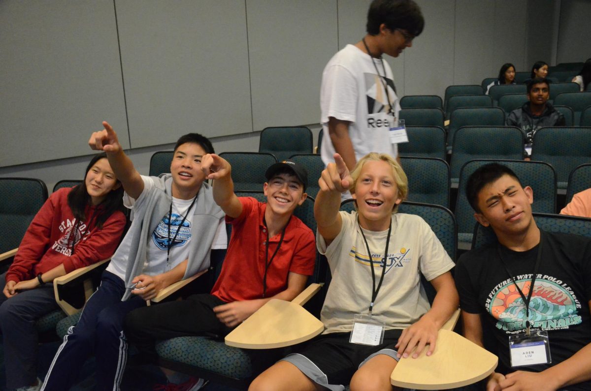 Attendees joke around in Nichols Auditorium before the alumni panel. 