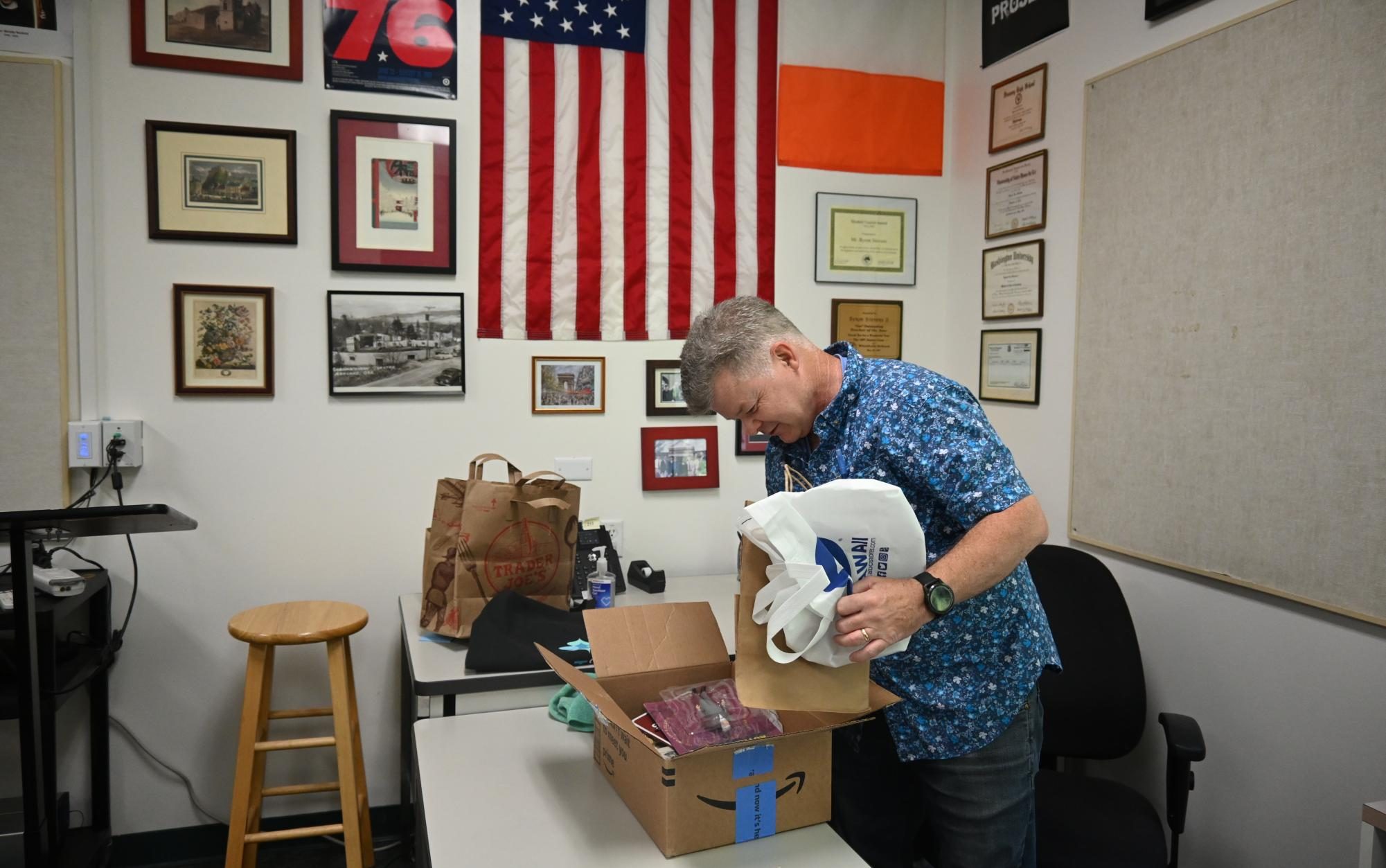 Upper school history teacher Byron Stevens unpacks a box in his classroom in preparation for the new school year. "The most fun is just the anticipation and the excitement as [the start] gets closer, and I have the greatest job in the world because it could start over every August," Stevens said.