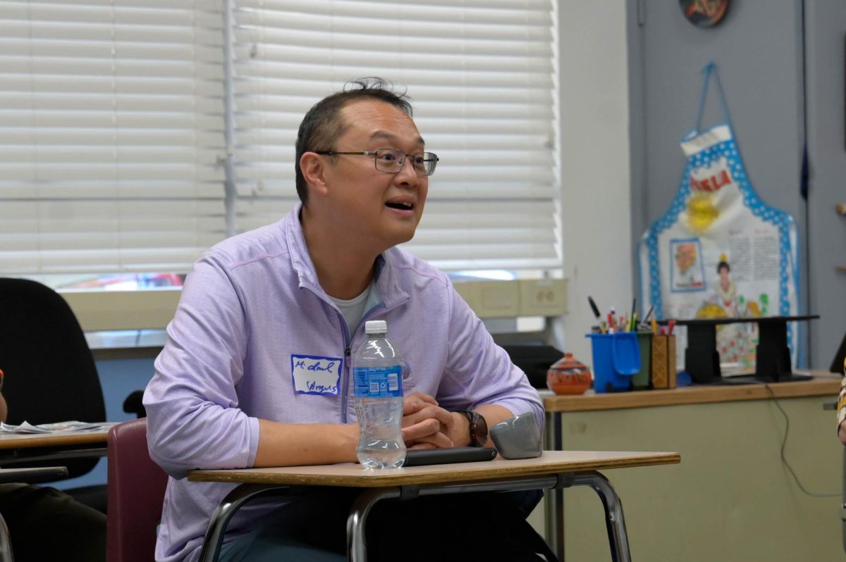 A parent nods along to Moss's explanation of how the foreign language department places students. Parents had 10 minutes for each class period. 