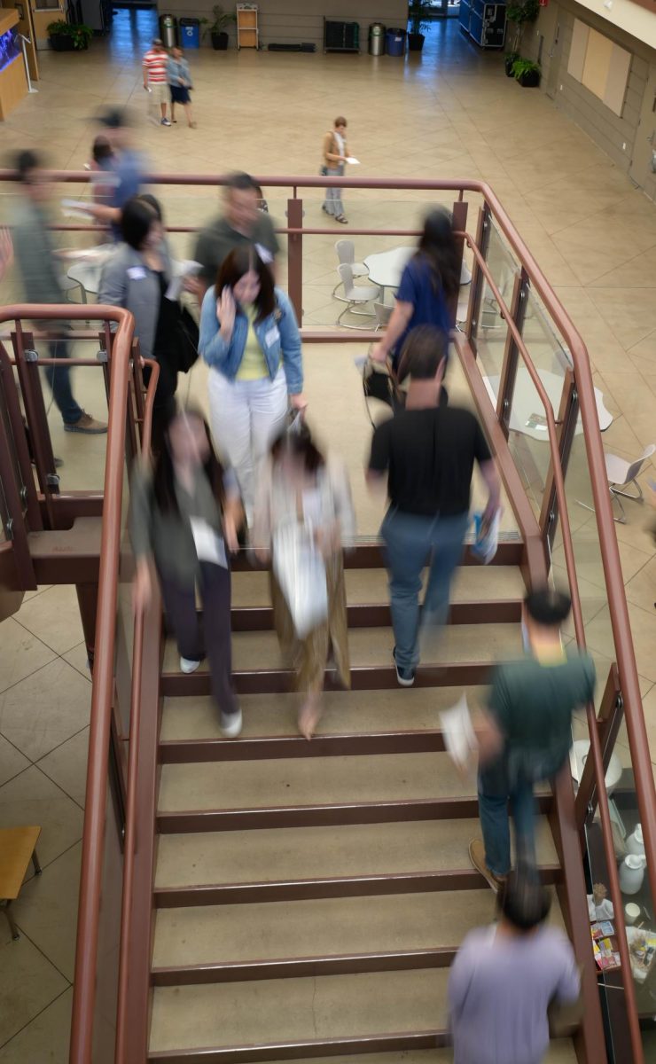 Parents file through Nichols Atrium as they head to their next classes. Student ambassadors guided them through the campus. 