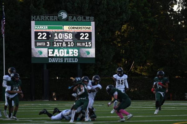 The new full video scoreboard displays information about the football game and play during the varsity football team's season opener on Sept. 5. The scoreboard replaced the fixed-digit LED scoreboard from previous years with customizable and dynamic features.