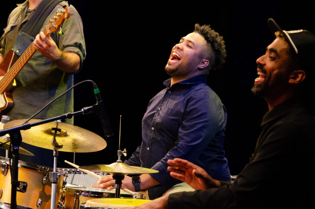 Percussionists Cesar Bacaro and Jafet Perez laugh as they sing together. While The Tropicales are an instrumental jazz group, all members of the band sang throughout the night.