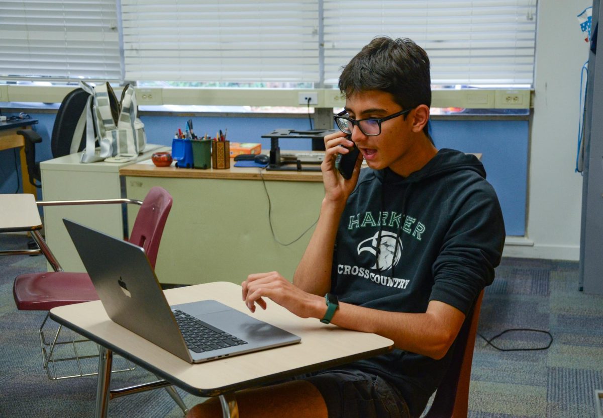 Green Team officer Kristiyan Kurtev (11) talks on the phone with an environmentalist. Throughout the whole event, he convinced five of them to start voting more consistently.