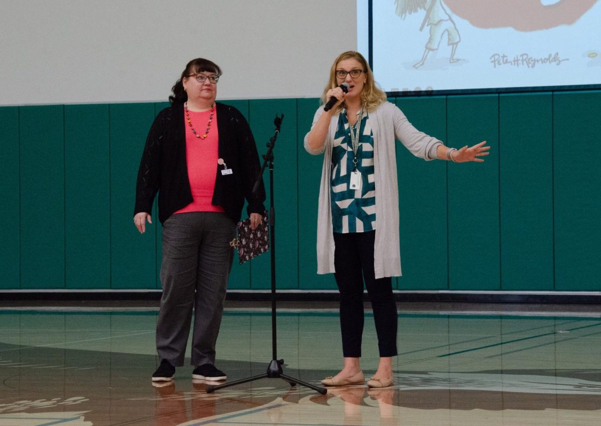 Librarians Connie Poulsen-Hollin and Meredith Cranston invite students to celebrate International Dot Day next Thursday during lunch. Popular picture book "The Dot" influenced the themes of creativity and exploration that are key to this holiday.