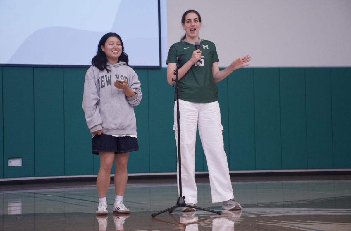 CareerConnect co-presidents Jia Jia Jiang (12) and Emily Mitnick (12) announce upcoming field-trip events. Some of the locations included the Giants Stadium and Fortinet.