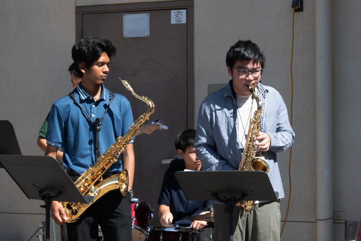 Gunn Jazz Band members play the saxophone in their performance during lunch at JEANC's Media Day. "Jazz is all about communication,” pianist Alex Zhupanob (12) said. “You can think of it as almost a conversation between the band members."