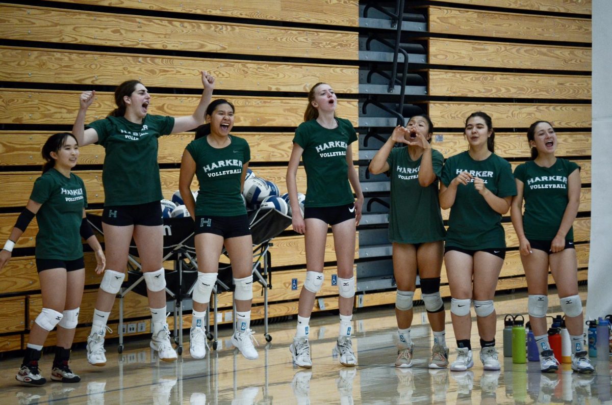 Varsity girls volleyball cheers during the scrimmage. They currently hold a 0-1 record. 