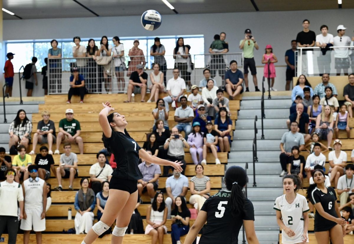 Outside hitter Elie Ahluwalia (11) jumps in preparation to hit the volleyball during the varsity girls volleyball match against Mills High School on Saturday. Elie's hits played a crucial role in the Eagles 25-21 second set win.