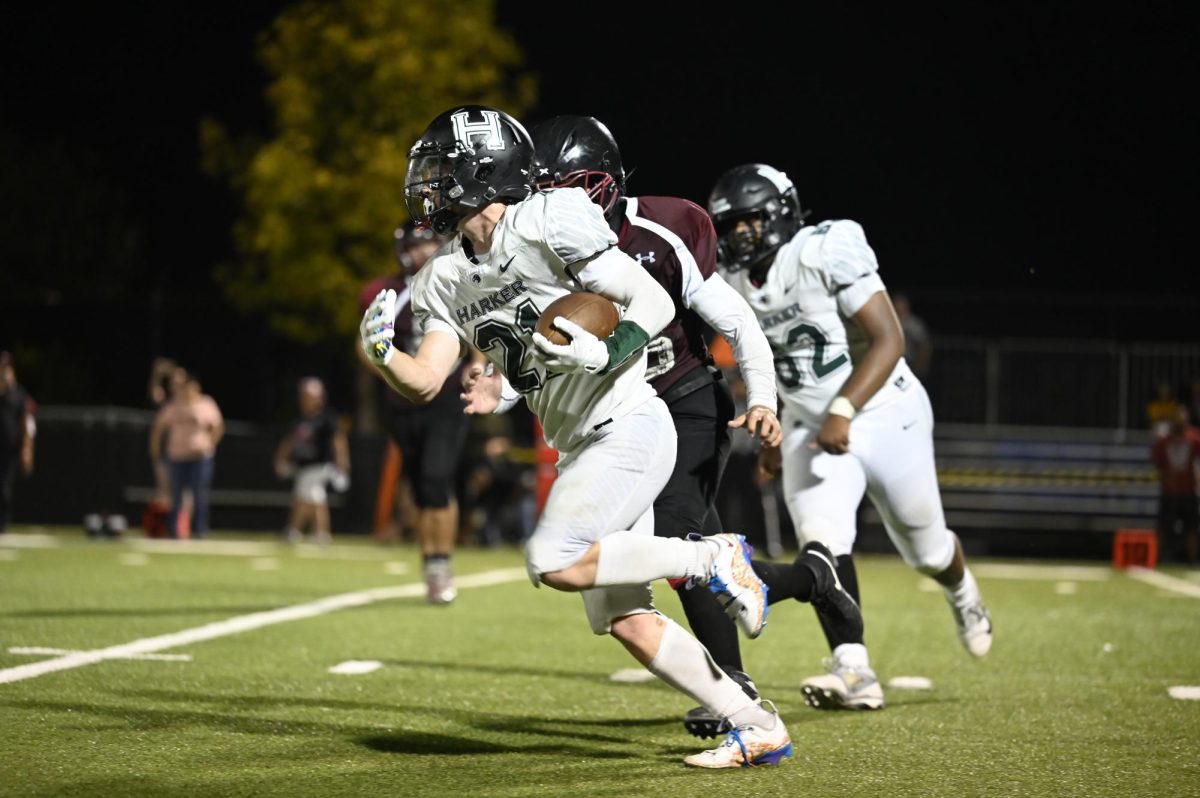 Jackson runs past a Hawk defender with the football. Jackson was stopped at the 6-yard line for a second down. 
