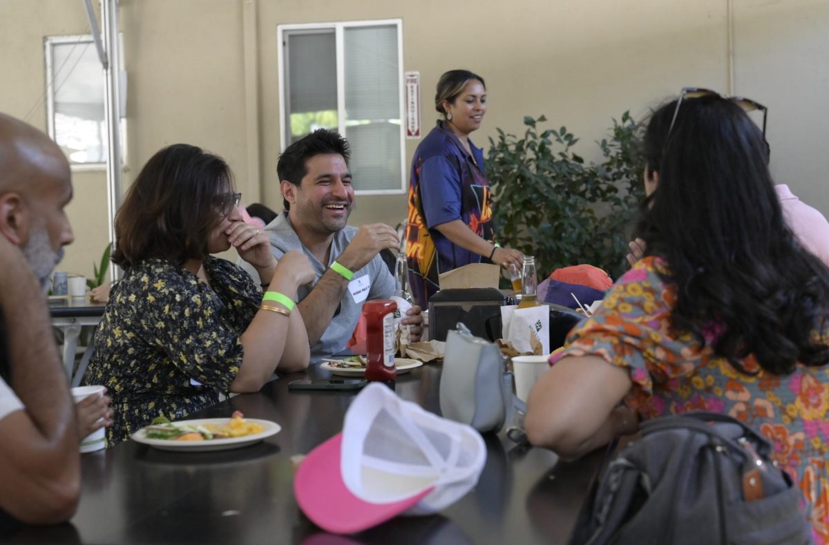 A table of alumni chats during the class of 2004's reunion on Saturday. This year's Harker Day marked the class of 2004's 20-year reunion. 