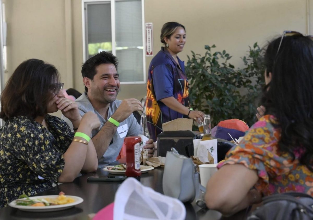 A table of alumni chats during the class of 2004's reunion on Saturday. This year's Harker Day marked the class of 2004's 20-year reunion. 