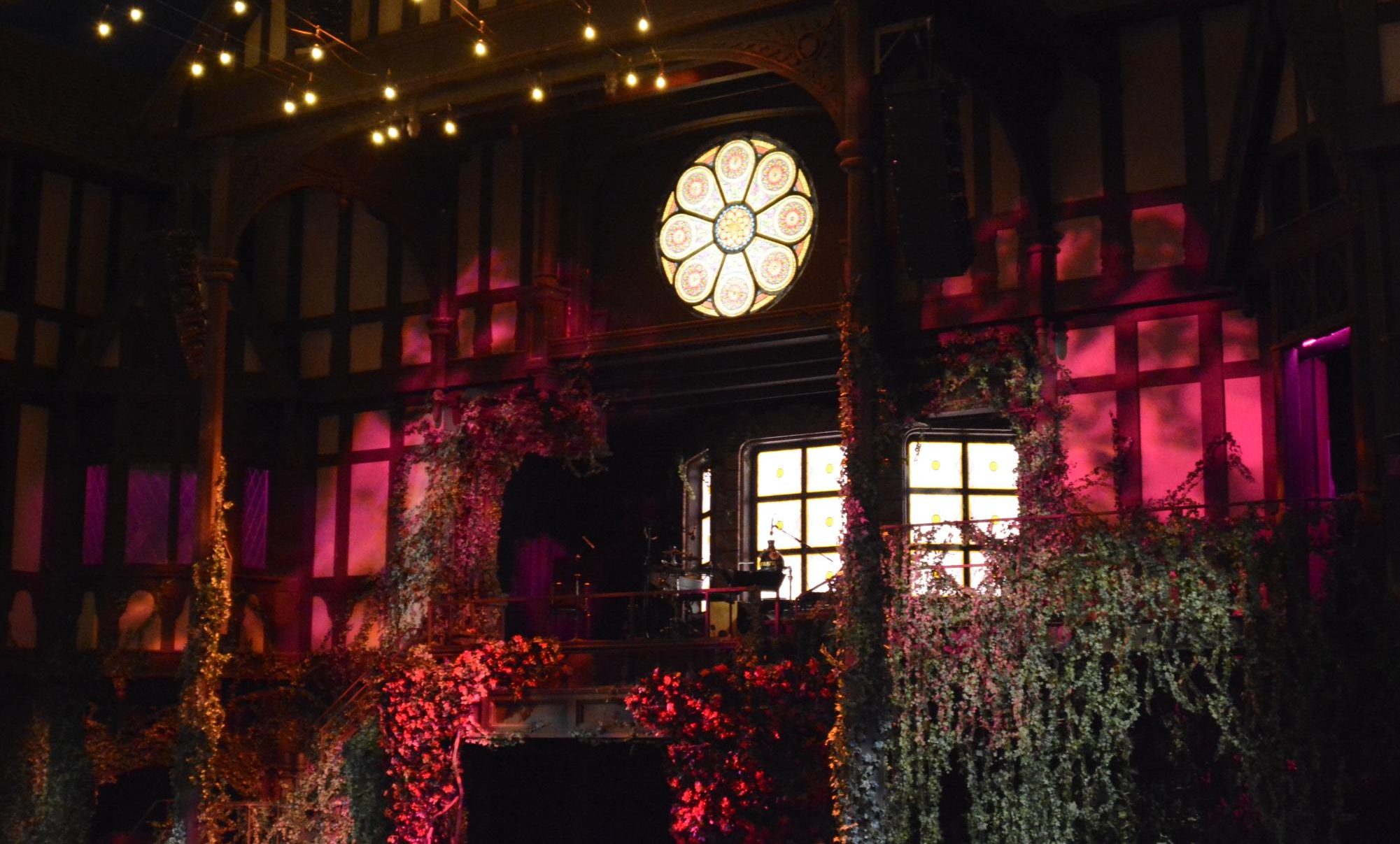 The Allen Elizabethan Theatre set features a Victorian-style balcony with a pink lighting. Students watched "Much Ado About Nothing" as the final play in the trip.