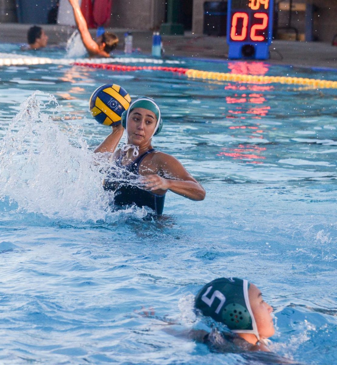 Senior Keren Eisenberg prepares to pass the ball to a teammate in the second quarter. As the final home game of the season, this match marked the team's senior night, with the stands packed with supportive friends and family members.