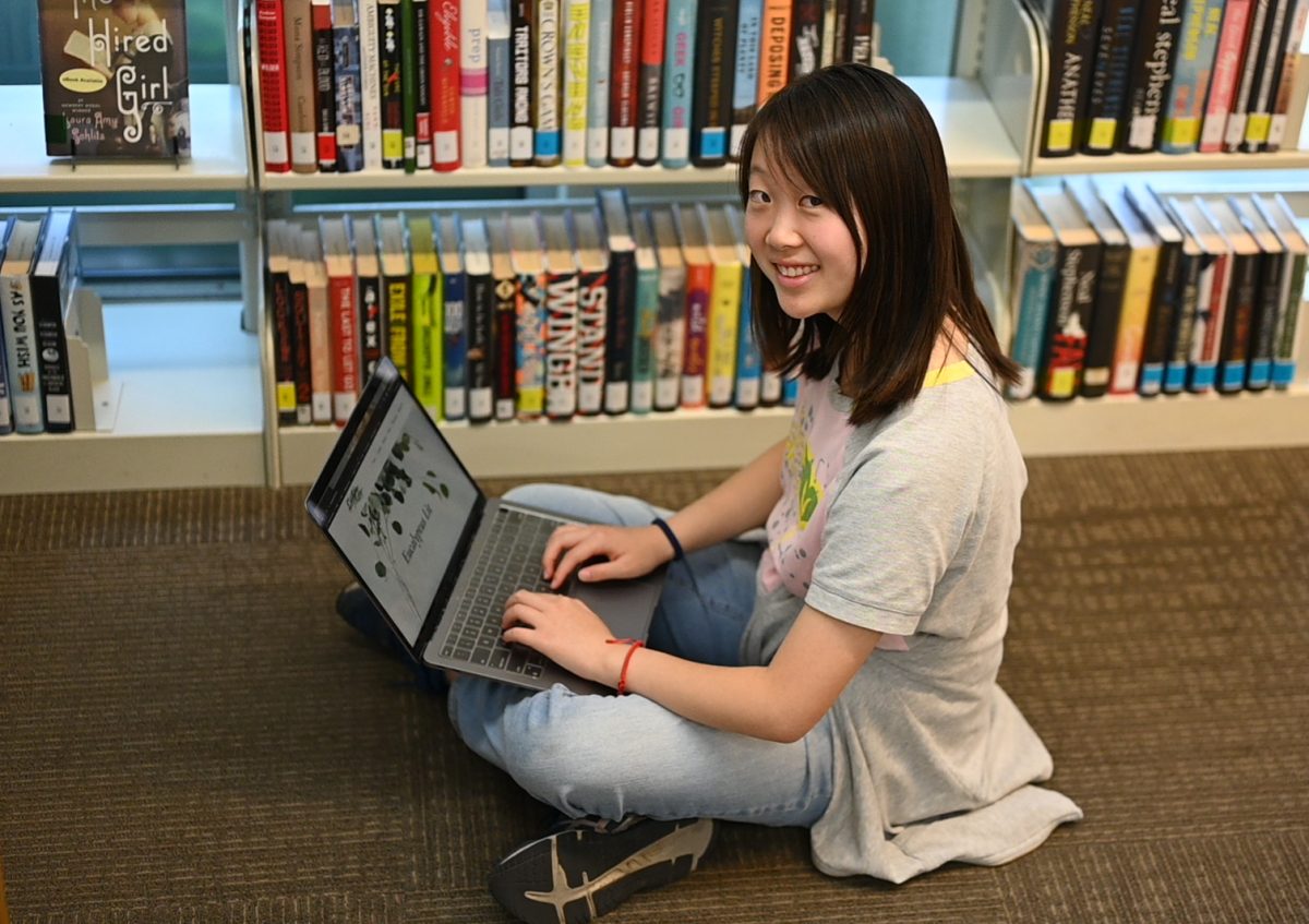 Co-Editor-in-Chief of Eucalyptus lit Iris Cai (12) peruses her literary magazine's website. “Our team is not only working together to help spread other voices, but we’re also helping each other grow and improve as well," Iris said.  