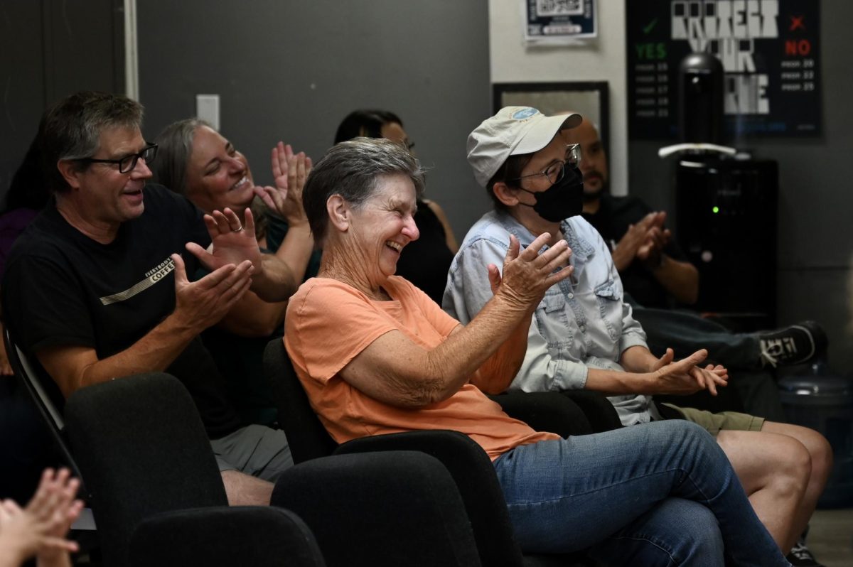 Forum attendees clap after the panel session concludes. Audience members shared their thoughts and asked questions during the Q&A discussion.