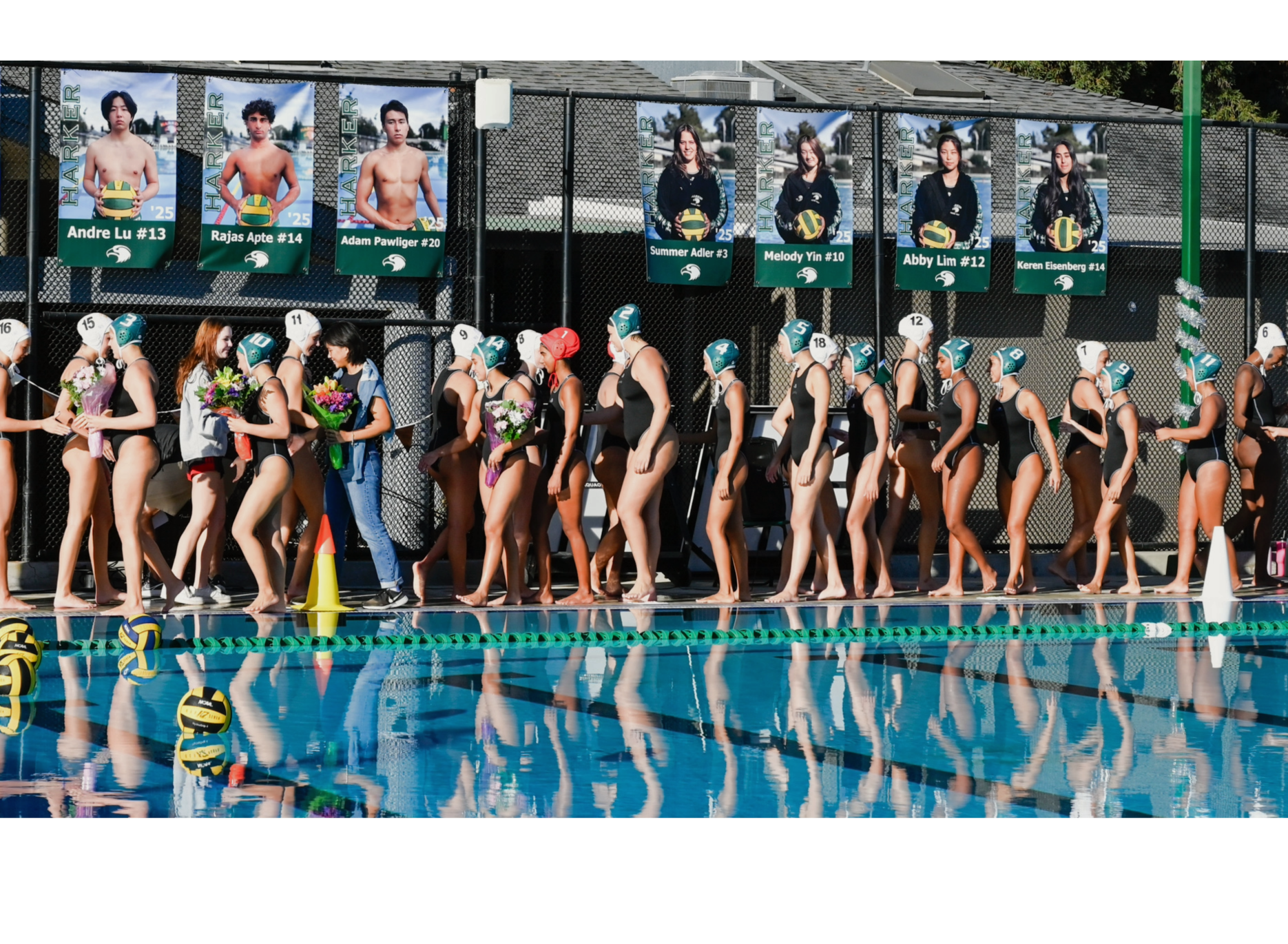 Varsity girls water polo team players high five members of the Mountain View team prior to their game. The Eagles beat their opponents 12-5 on senior night. 