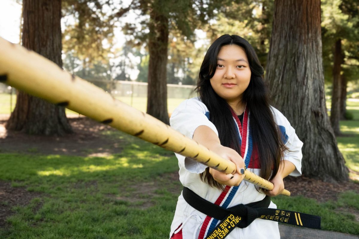 “My karate teachers emphasize that as black belts, we should be living up to the standard of our rank and acting as an example for the students who are lower-ranked.' When I’m helping out and someone messes up, I don't necessarily say, ‘You did this wrong, try to do this.’ I take a more relaxed approach and act out what they did a little comically. It's finding the balance between being strict and being more playful with the students," senior Claire Perng said.