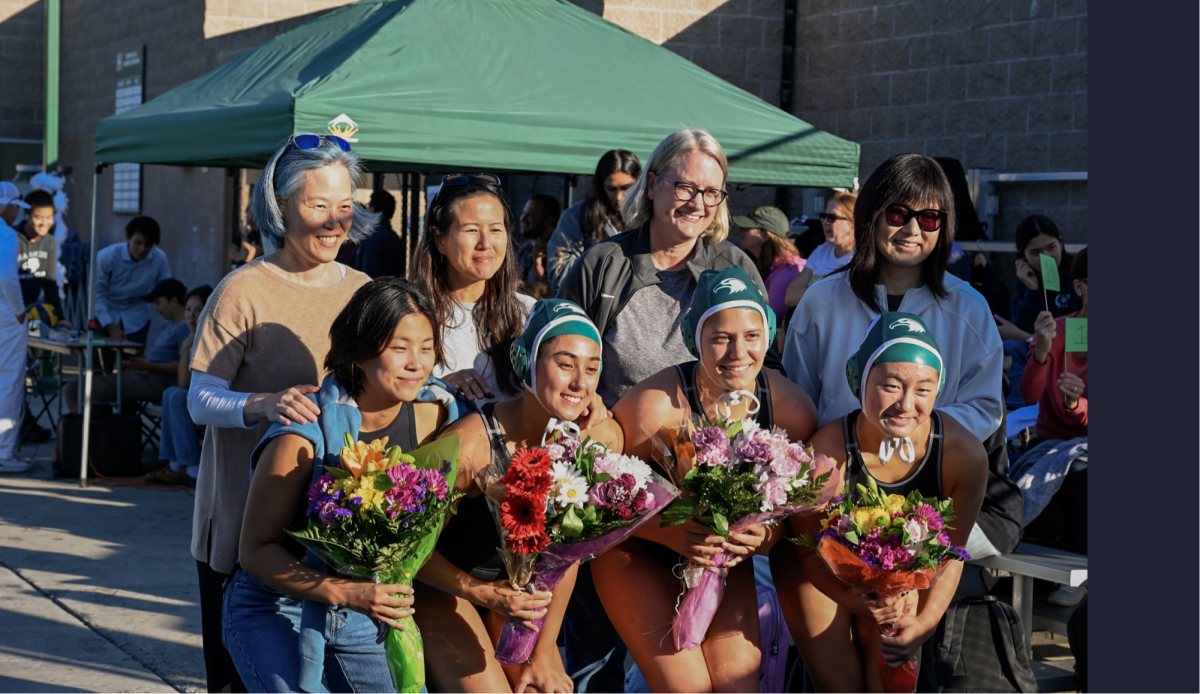 Varsity girls water polo seniors smile for a picture with their mothers. The team concluded their season with an overall record of 17-6. 