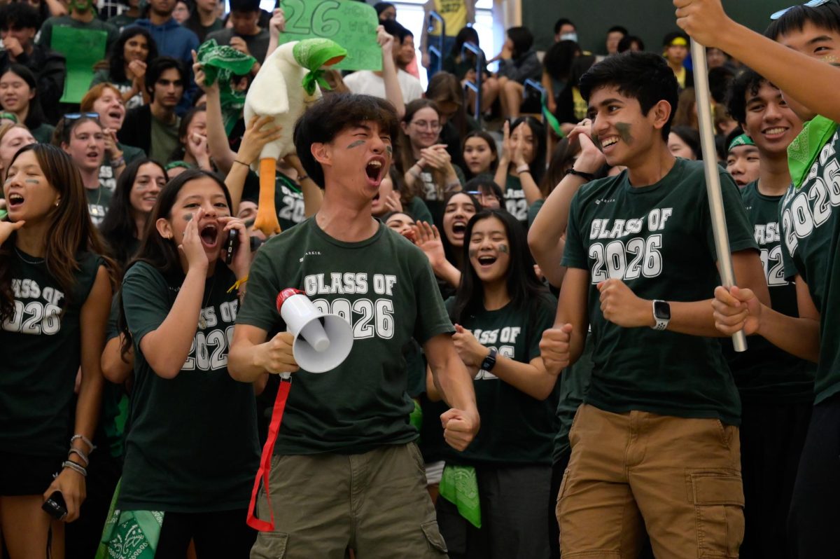 ON YOUR FEET: Junior Luke Wu celebrates the Class of 2026's relay race victory. Their representatives Spencer Chang and Brady Tse were the only two who were not disqualified for rule breaking.

“Everybody had a lot of spirit and we were all putting in our best effort to win,” Junior Christy Ma said. “My favorite part was the energy in the room.”