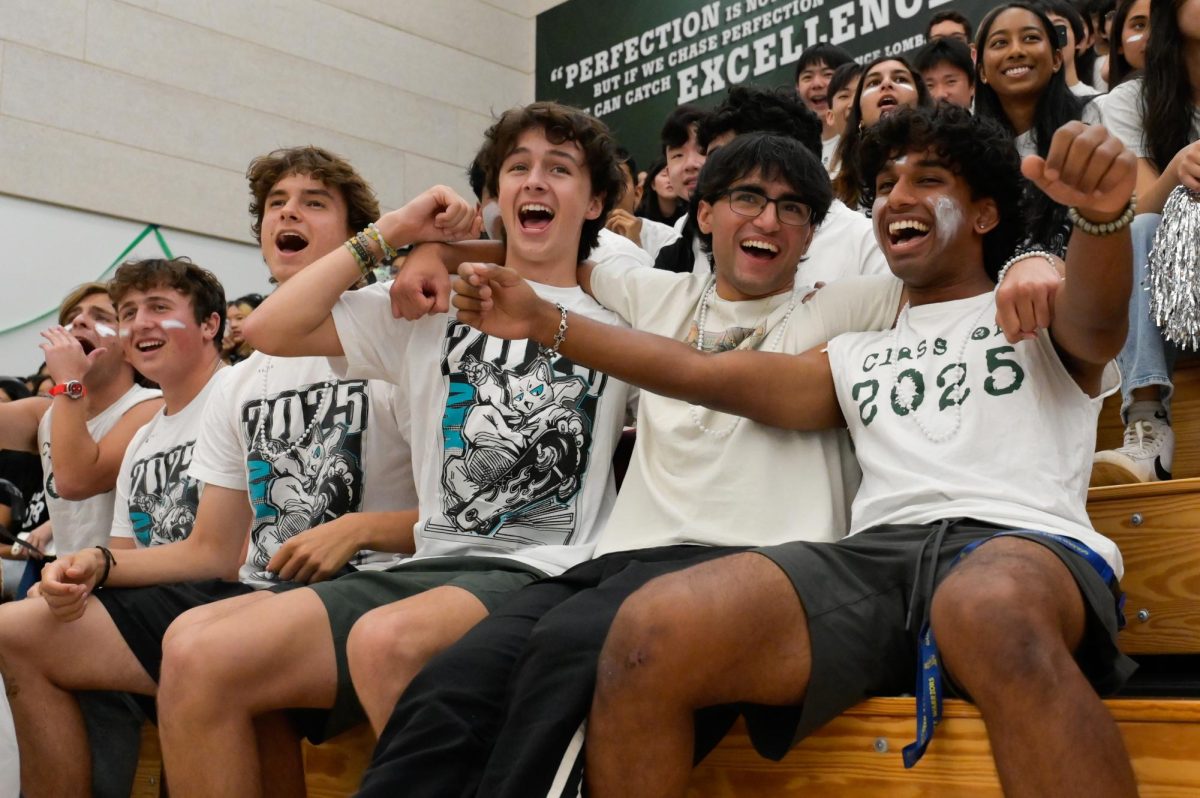 RIDING VICTORY: Seniors Rayan Arya, Rishi Lalwani, Jacob Smith and Liam Jeffers dance along during the "Disney" routine. The seniors face the juniors again at Harker Day's tug-of-war finals on Saturday. 