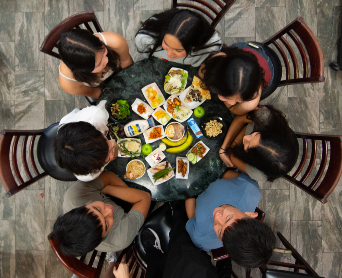 Students chat and eat together during lunch. Every day, the kitchen staff serves over a thousand lunches within an hour. 