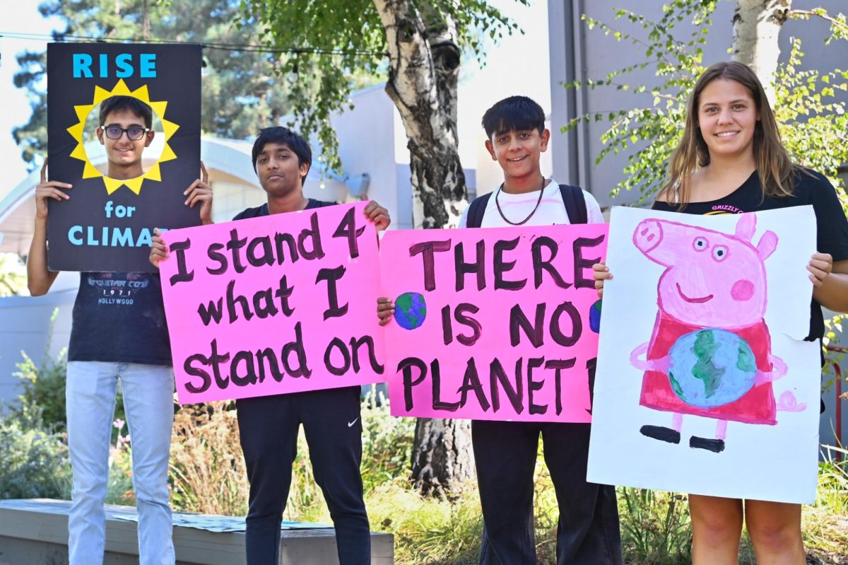 Green Team members hold up signs during an on-campus demonstration to bring awareness to the growing climate crisis. Over half of Generation Z has participated in protests at some point in time.