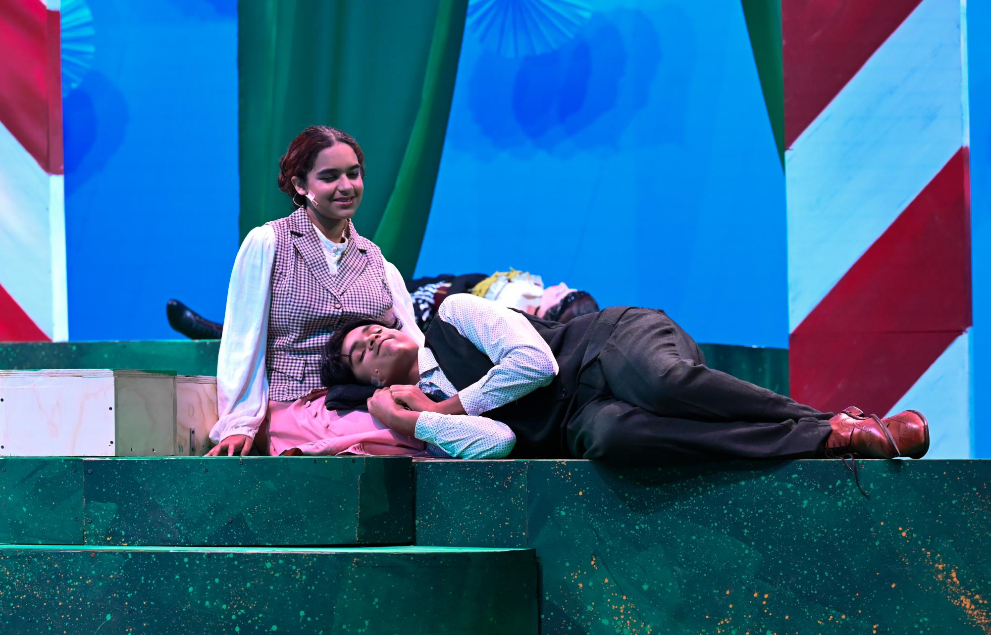 Lysander, played by sophomore Rivan Nair, falls asleep in Hermia's lap, played by senior Fern Biswas. "After the final show, I felt a wave of sad pride come over me,” Fern said.