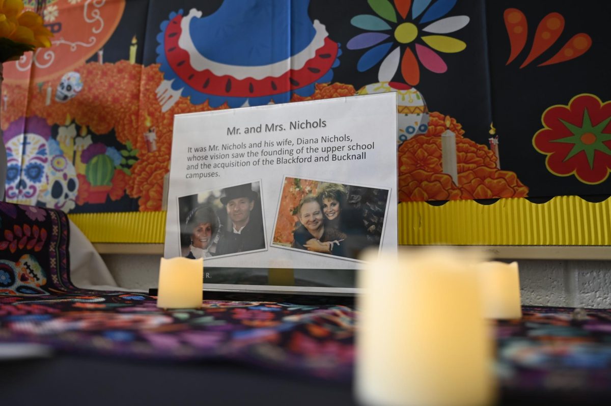 Spanish teacher Diana Moss sets up altars in Main Hall each year for Día de los Muertos. “On the altar we have a good number of teachers, including Mr. and Mrs. Nichols and a couple of our English teachers,” Moss said.